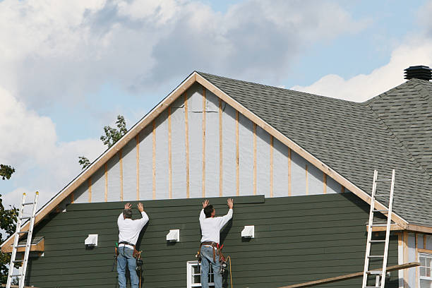 Professional Siding Replacement technician working in Greenville, NC